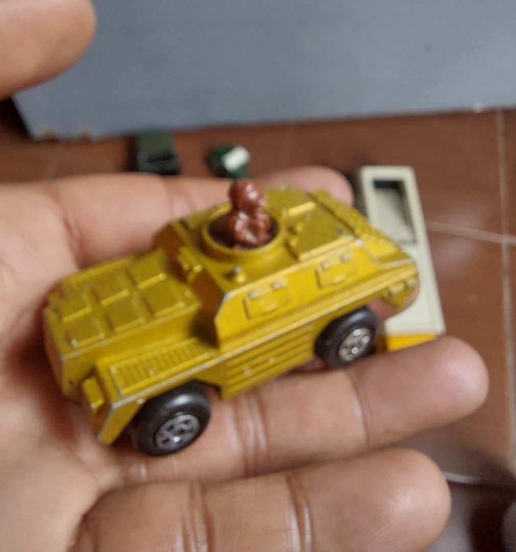 Vintage Matchbox Skybusters Armored Car (Category: Vehicle & Diecast Models) located in Pasig City. Submitted by liezel-liezel (Listing ID 1418826728, Image 1). Description: - Vintage Matchbox Skybusters armored car toy - Features a yellow body - Includes a brown figure in the turret - Underside marked with "Matchbox" and "Lesney Products", Made in England - Black wheels - Detailed design.