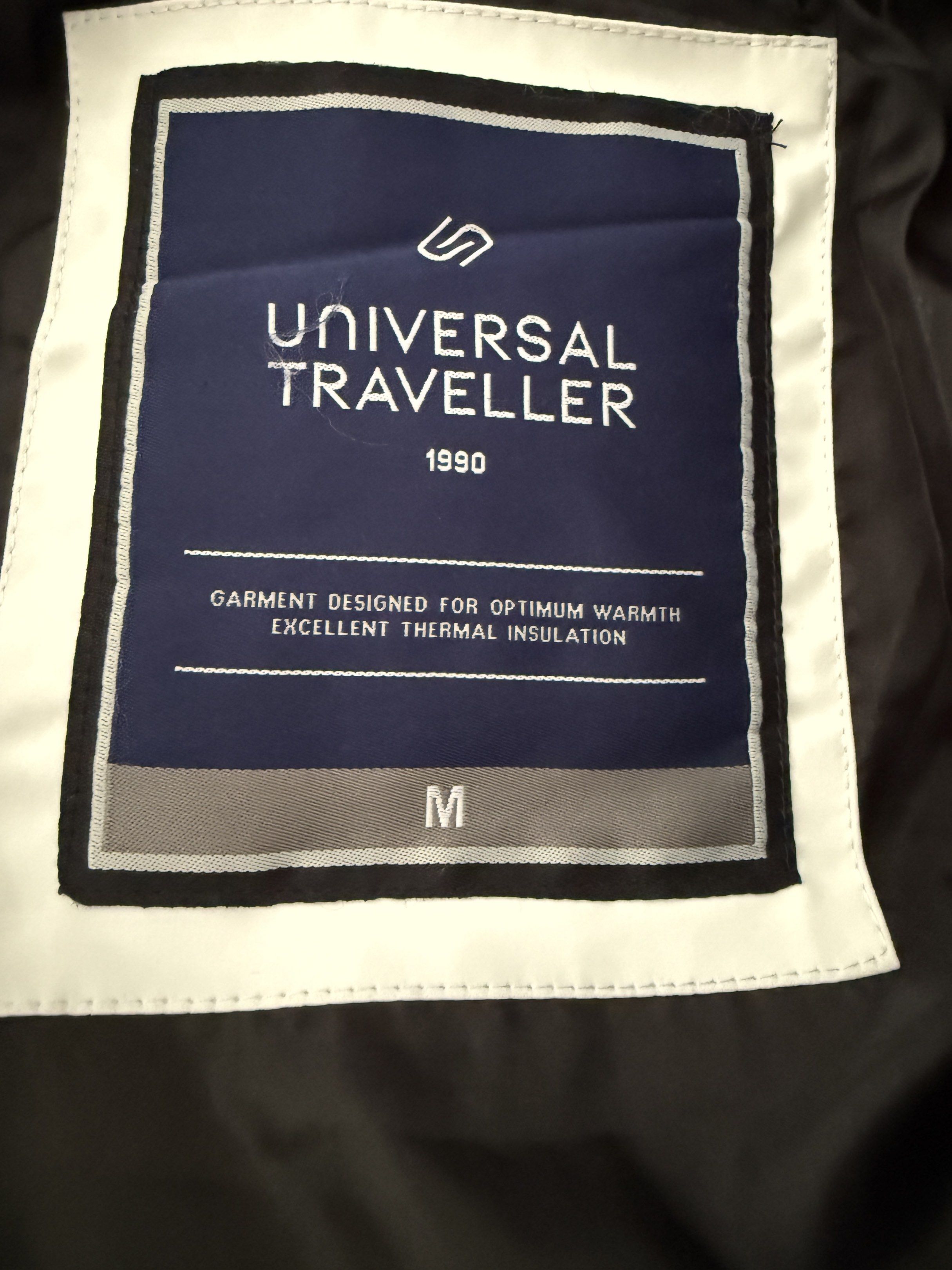White Down Jacket (Category: Coats, Jackets and Outerwear) located in Singapore. Submitted by _xone_ (Listing ID 1418800331, Image 3). Description: - Universal Traveller white padded jacket - Worn for only one trip to Finland/Norway - Size M - Keep you warm and toasty in under -20 degree .
