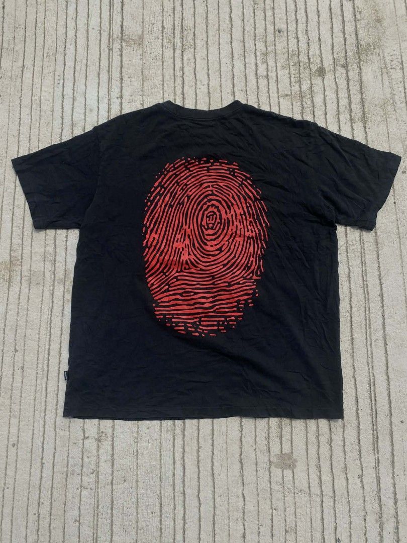 WHOSIS Black T-shirt (Category: Tshirts & Polo Shirts ) located in Davao. Submitted by jsthr1ft (Listing ID 1418827127, Image 2). Description: - Black WHOSIS T-shirt - Red logo on front - Large red fingerprint design on back - Short sleeves - Crew neck - Soft fabric - Size: Not specified.