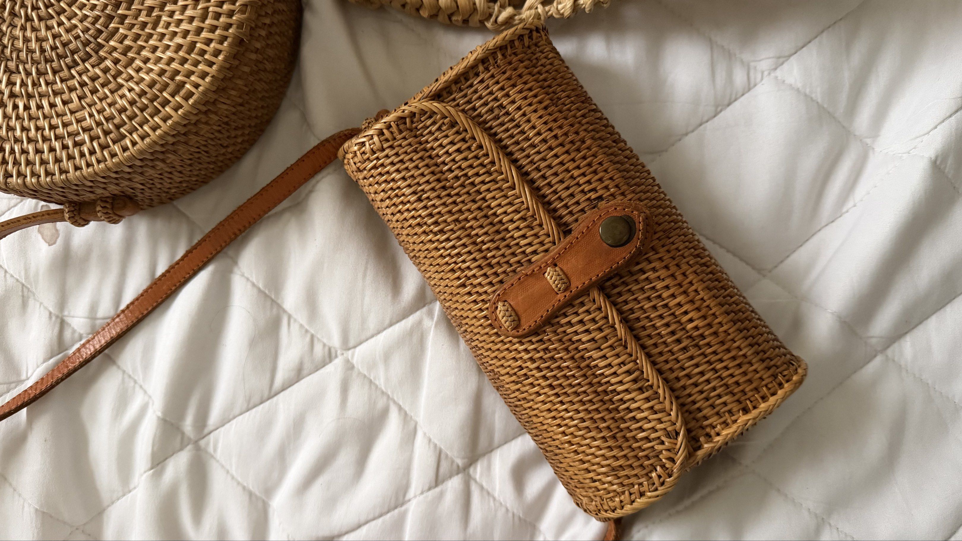 Woven Rattan Handbags (Category: Clutches) located in Pasig City. Submitted by declutterpsg (Listing ID 1418868016, Image 2). Description: - Round crossbody bag with leather strap and button closure. - Rectangular crossbody bag with leather strap and button closure. - Large tote bag with woven handles. All bought from Bali Indonesia Round- 400 pesos Rectangle- 500 pesos ❌ sold Tote- 500 pesos.