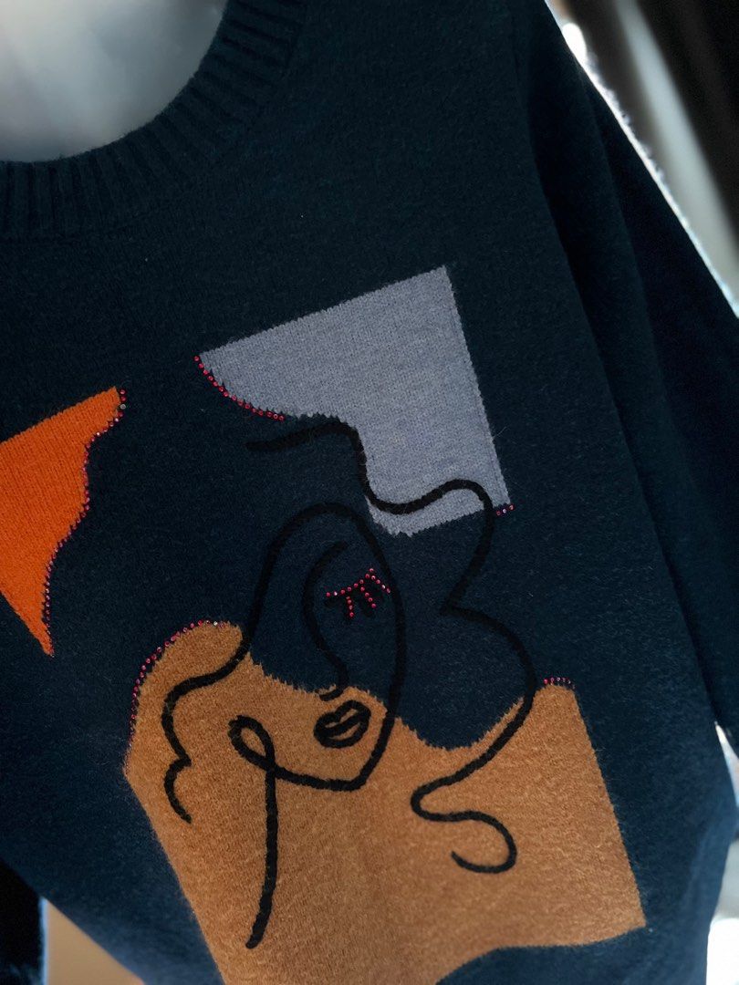 Abstract Face Design Sweater (Category: Longsleeves) located in Bulacan. Submitted by monaami (Listing ID 1413440317, Image 3). Description: I bought this from a local store in Myeongdong, South Korea. Small to Medium size - Dark blue sweater - Unique abstract face design on the front - Round neckline - Long sleeves - Color accents: orange, light blue, and brown - Face design includes pink embellishments - Solid dark blue back.