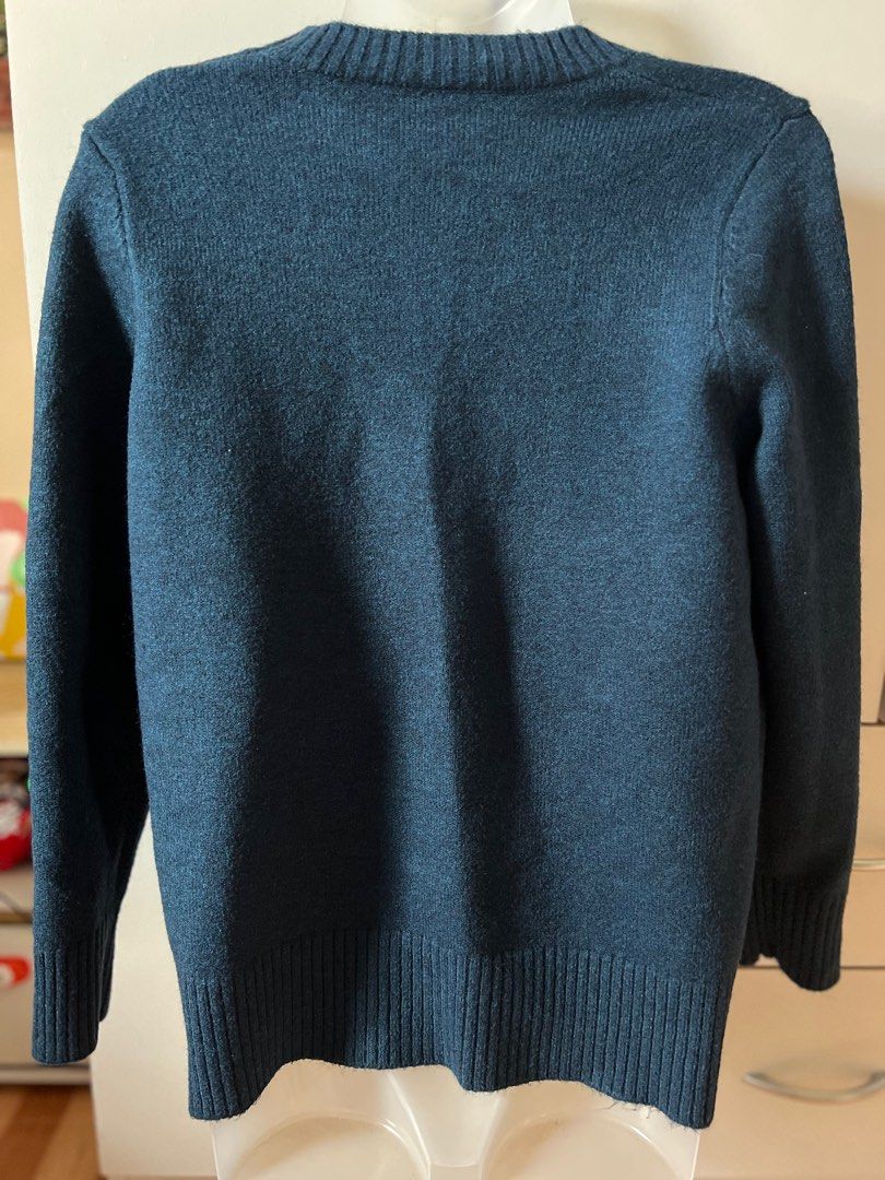 Abstract Face Design Sweater (Category: Longsleeves) located in Bulacan. Submitted by monaami (Listing ID 1413440317, Image 2). Description: I bought this from a local store in Myeongdong, South Korea. Small to Medium size - Dark blue sweater - Unique abstract face design on the front - Round neckline - Long sleeves - Color accents: orange, light blue, and brown - Face design includes pink embellishments - Solid dark blue back.