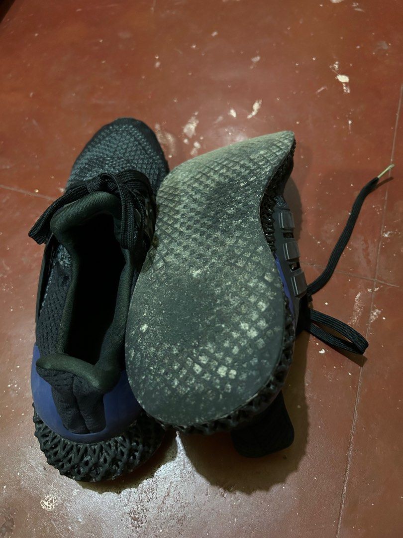 Adidas Ultraboost 4D Black size 10 (Category: Sneakers) located in Pasay City. Submitted by lils_shoppe (Listing ID 1413449558, Image 3). Description: - Adidas Ultraboost 4D sneakers - Color: Black - Features 4D midsole - Black laces - Signs of wear on soles and uppers - Blue accent on heel counter - Adidas logo visible .