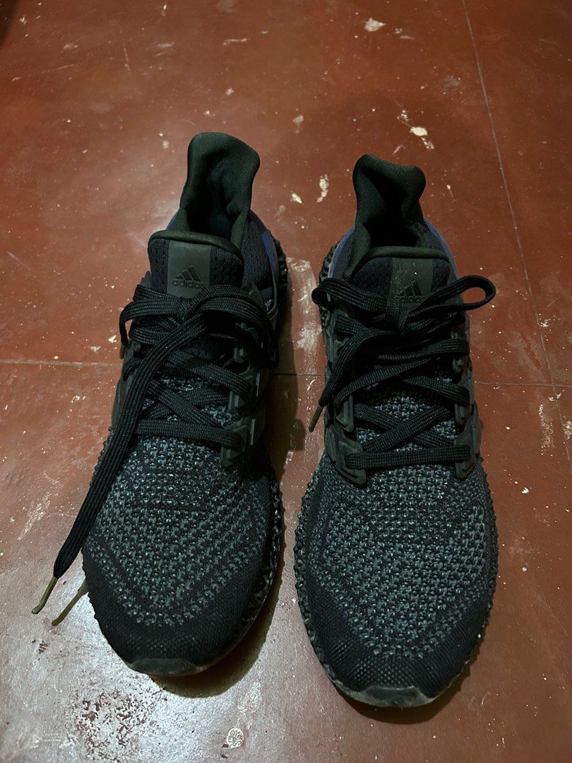 Adidas Ultraboost 4D Black size 10 (Category: Sneakers) located in Pasay City. Submitted by lils_shoppe (Listing ID 1413449558, Image 1). Description: - Adidas Ultraboost 4D sneakers - Color: Black - Features 4D midsole - Black laces - Signs of wear on soles and uppers - Blue accent on heel counter - Adidas logo visible .