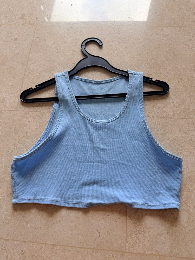 Alo Yoga Ribbed Tank Top - Baby Blue (Category: Activewear) located in Singapore. Submitted by chanelyjy (Listing ID 1413555582, Image 1). Description: - Alo Yoga tank top - Light blue ribbed fabric - Cropped length - Scoop neckline - Measurements in photos - Perfect for workouts and casual wear • Brand: Authentic Alo Yoga • Color: Soft light blue (pastel/ice blue) • Style: Ribbed crop tank, scoop neck, racerback design, fitted and stretchy • Mat
