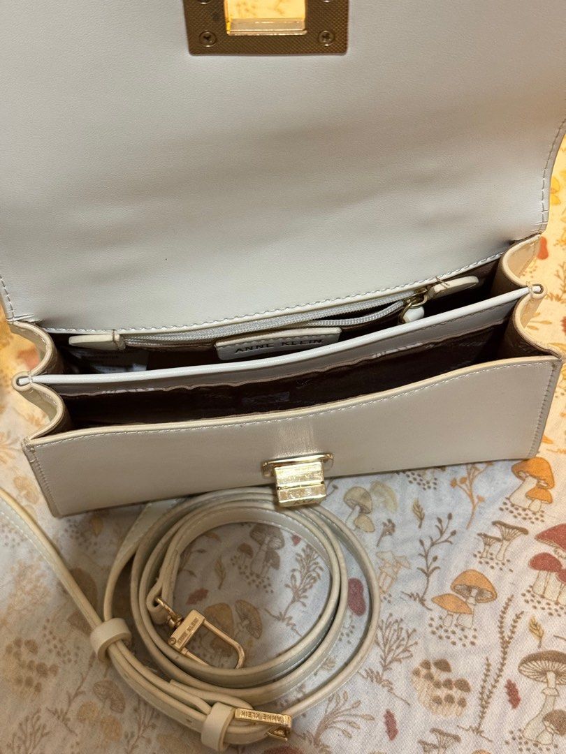 Anne Klein Top Handle Cross Body Bag (Category: Cross-body Bags) located in Cebu City. Submitted by d.cluttering (Listing ID 1413621330, Image 2). Description: — Priced to Sell / open to reasonable offers Anne Klein Top Handle Cross body bag Comes with original strap Small but can fit a lot .