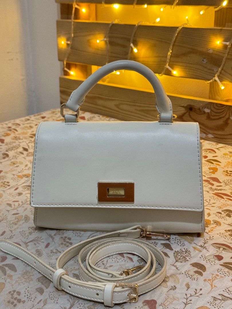 Anne Klein Top Handle Cross Body Bag (Category: Cross-body Bags) located in Cebu City. Submitted by d.cluttering (Listing ID 1413621330, Image 1). Description: — Priced to Sell / open to reasonable offers Anne Klein Top Handle Cross body bag Comes with original strap Small but can fit a lot .