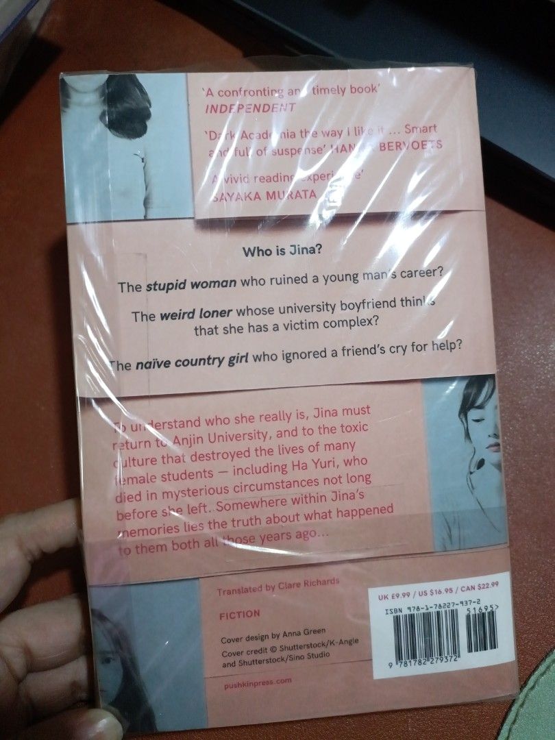 Another Person by Kang Hwagil (Category: Storybooks) located in Manila. Submitted by rosyclouds94 (Listing ID 1413470345, Image 2). Description: Authentic Paperback Copy of "Another Person" by Kang Hwagil, bought from Fully Booked. Read only once. - Fiction novel translated from Korean. - Explores the mystery of Jina and events at Anjin University. - Published by Pushkin Press. - Features a pink and white cover design with critic quotes..
