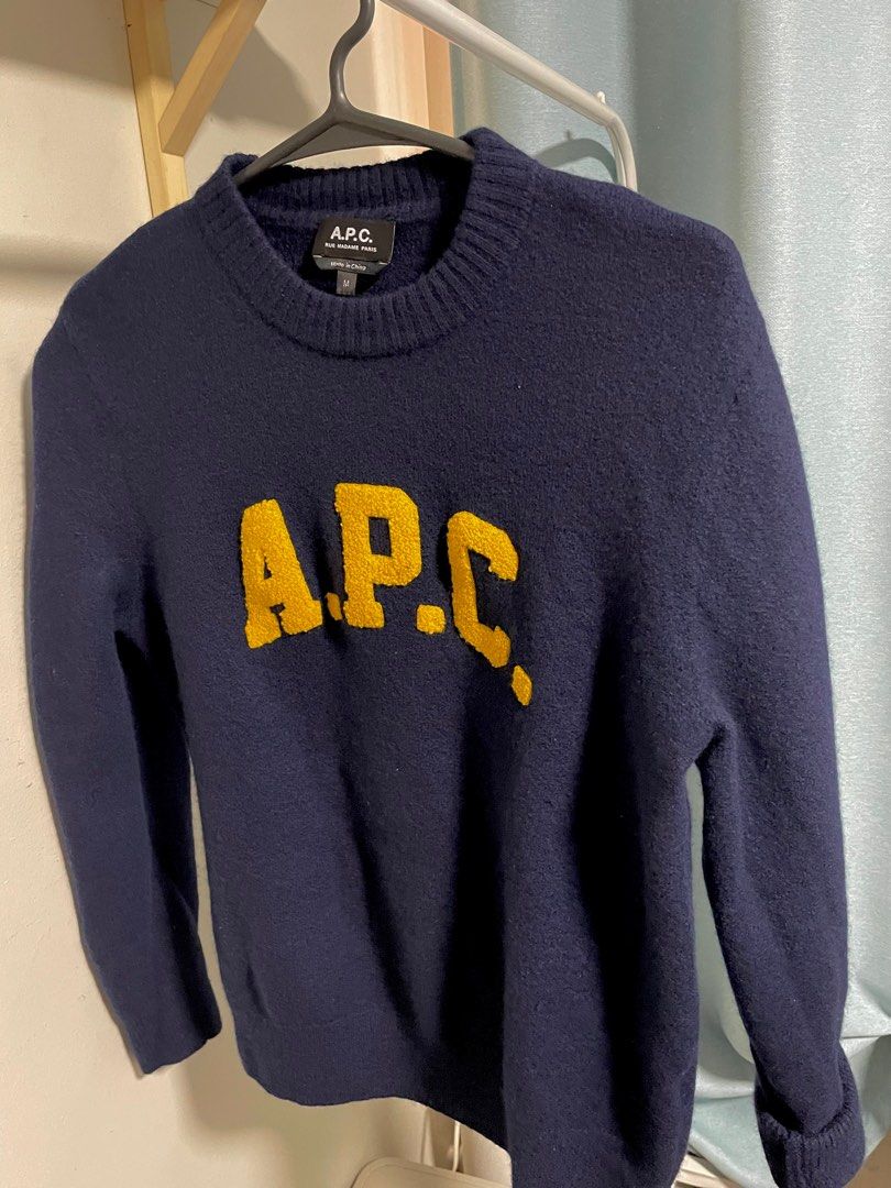 APC Joshua Wool Sweater Dark Navy (preloved) (Category: Tshirts & Polo Shirts ) located in Mandaluyong City. Submitted by mysellingcorner (Listing ID 1413487249, Image 3). Description: APC Unisex Sweater — Medium (fits Small due to slim fit) Color: Navy Blue with Yellow Accents • 100% virgin wool • Crew neck • Contrasting embroidered front logo • Long sleeves • Ribbed cuffs and hem • Straight hem Lightly worn (used once). Purchased for P16,000. S