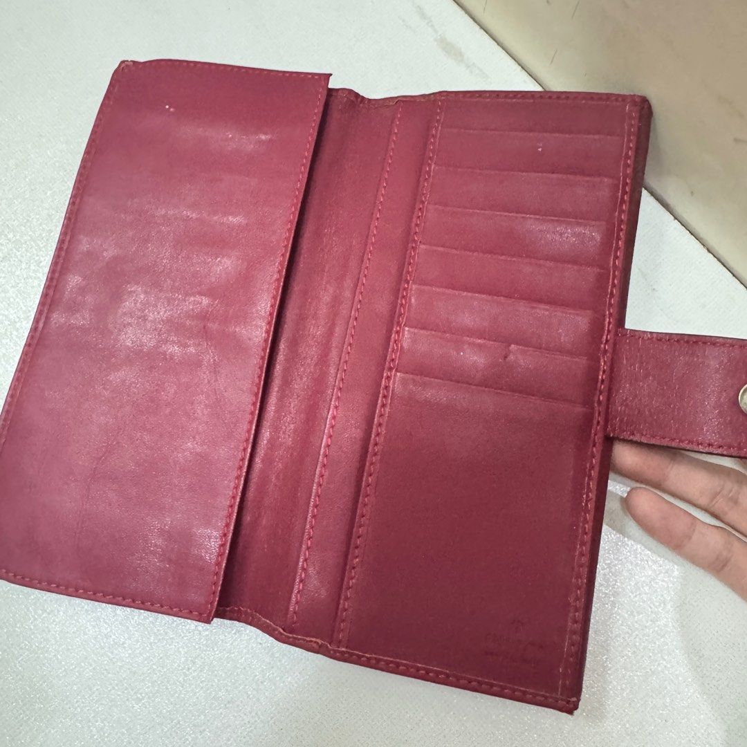 Authentic Gucci GG Canvas Long Wallet (Category: Luxury Bags & Wallets) located in Quezon City. Submitted by kb0030 (Listing ID 1413587436, Image 2). Description: - Authentic Gucci wallet - Iconic GG canvas design - Burgundy leather interior - Multiple card slots and compartments - Heart-shaped clasp with Gucci logo tarnished not that gold anymore with scratches - Dimensions: Approximately 7.5" (L) x 4" (W) Well loved but still in great condition