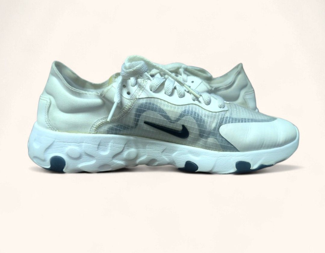 Authentic Nike React Renew Lucent Element 55 White Sneakers Us 9 (Category: Sneakers) located in Davao. Submitted by angel_924 (Listing ID 1413545115, Image 3). Description: White Nike React Element 55 sneakers. Features a white and translucent upper with a dark blue Nike swoosh. The sole is white with dark blue accents. The shoes have white laces and a React foam midsole..