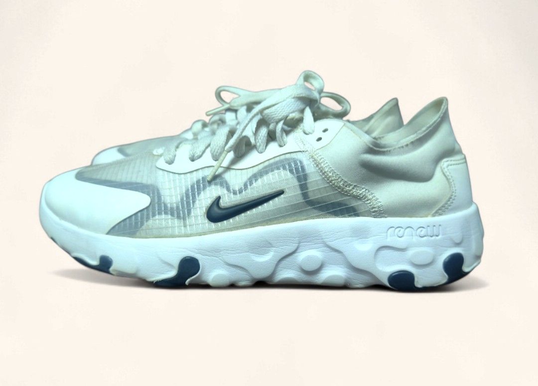 Authentic Nike React Renew Lucent Element 55 White Sneakers Us 9 (Category: Sneakers) located in Davao. Submitted by angel_924 (Listing ID 1413545115, Image 1). Description: White Nike React Element 55 sneakers. Features a white and translucent upper with a dark blue Nike swoosh. The sole is white with dark blue accents. The shoes have white laces and a React foam midsole..