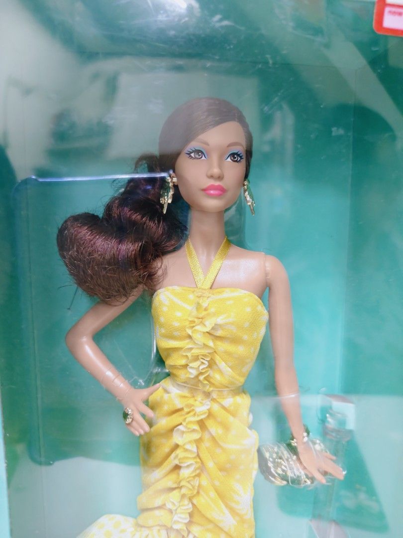 Barbie Teresa 35th Anniversary Doll (Category: Figurines & Statues) located in Pasig City. Submitted by lian_sam (Listing ID 1413600043, Image 2). Description: - Barbie Teresa 35th Anniversary Edition - Features a doll with brown hair and a yellow dress - Still in original packaging - NRFB bot not mint.