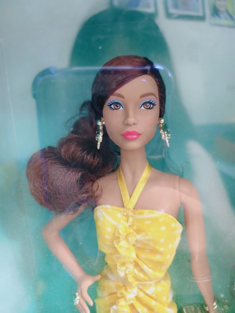 Barbie Teresa 35th Anniversary Doll (Category: Figurines & Statues) located in Pasig City. Submitted by lian_sam (Listing ID 1413600043, Image 1). Description: - Barbie Teresa 35th Anniversary Edition - Features a doll with brown hair and a yellow dress - Still in original packaging - NRFB bot not mint.