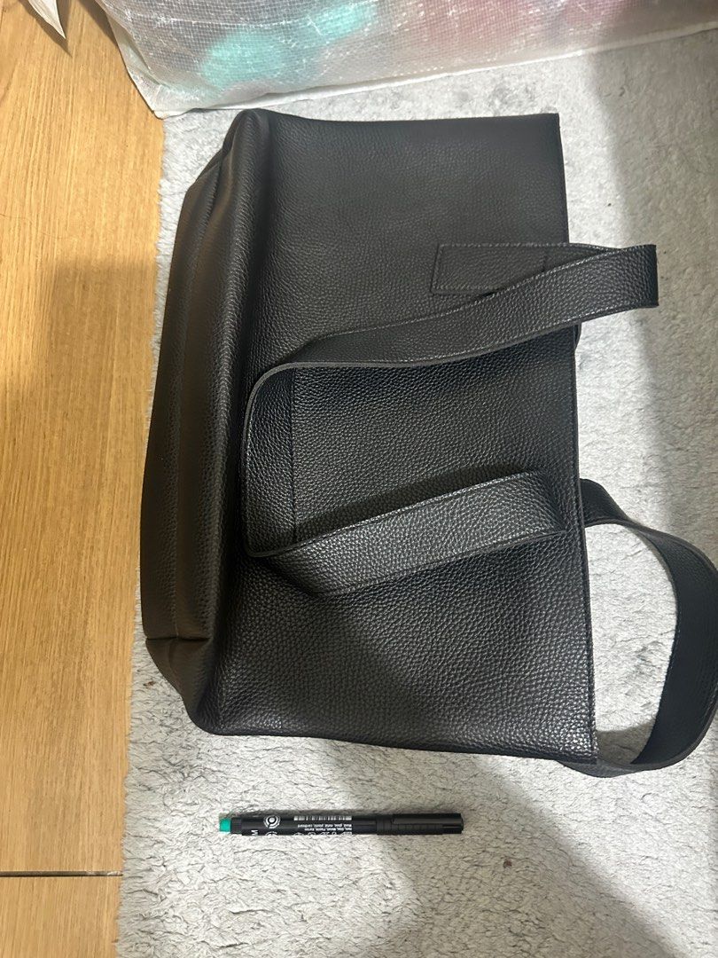 Black faux leather tote bag (Category: Tote Bags) located in Pasig City. Submitted by _janelane (Listing ID 1413577135, Image 2). Description: No to minimal flaws .