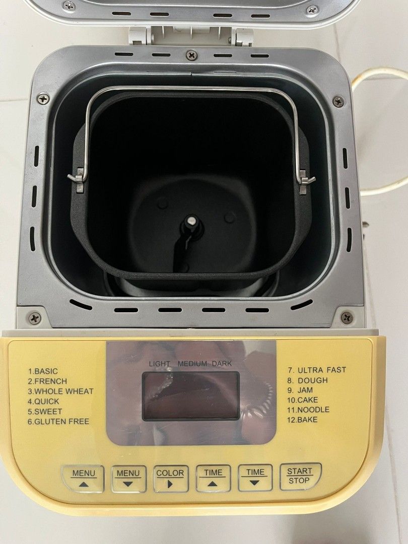 Bread Maker - Multiple Settings (Category: Breadmakers) located in Singapore. Submitted by henryhuat (Listing ID 1413582961, Image 1). Description: Bread maker offers a variety of settings including basic, french, whole wheat, quick, sweet, gluten free, ultra fast, dough, jam, cake, noodle, and bake. It has a digital display and adjustable color and time settings. Ready to make fresh bread!.