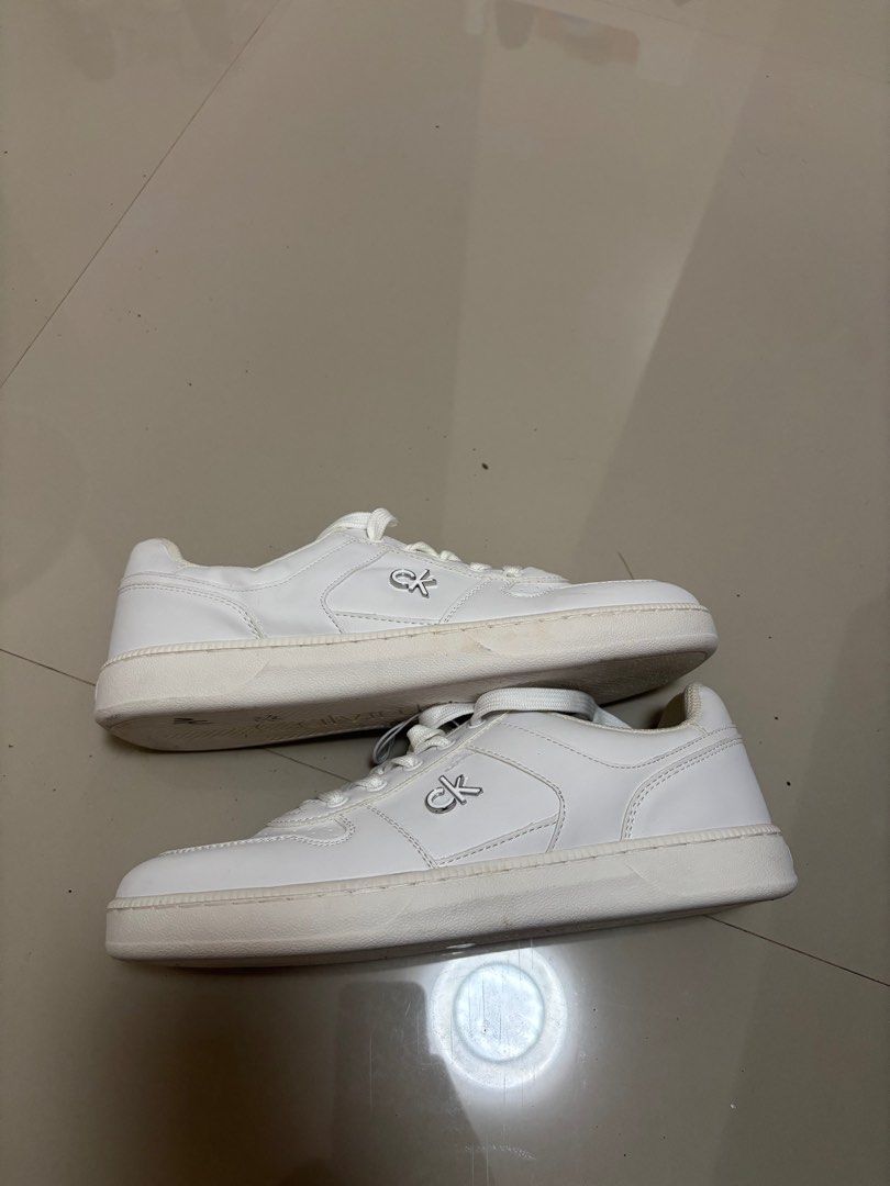 Calvin Klein White Sneakers from US (Category: Sneakers) located in Meycauayan. Submitted by retroselectionph (Listing ID 1413571555, Image 2). Description: - White Calvin Klein sneakers - Brand new, unused - nakatabi lang sa lagayan - size 8.5 1k php.