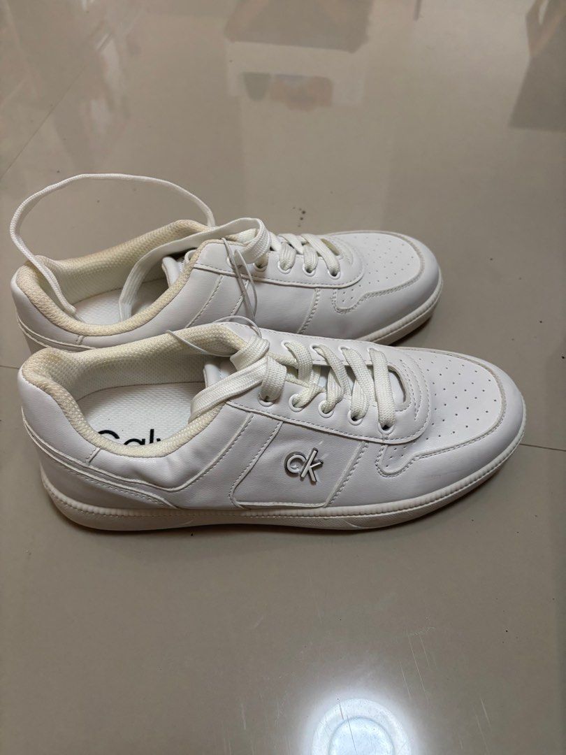 Calvin Klein White Sneakers from US (Category: Sneakers) located in Meycauayan. Submitted by retroselectionph (Listing ID 1413571555, Image 1). Description: - White Calvin Klein sneakers - Brand new, unused - nakatabi lang sa lagayan - size 8.5 1k php.