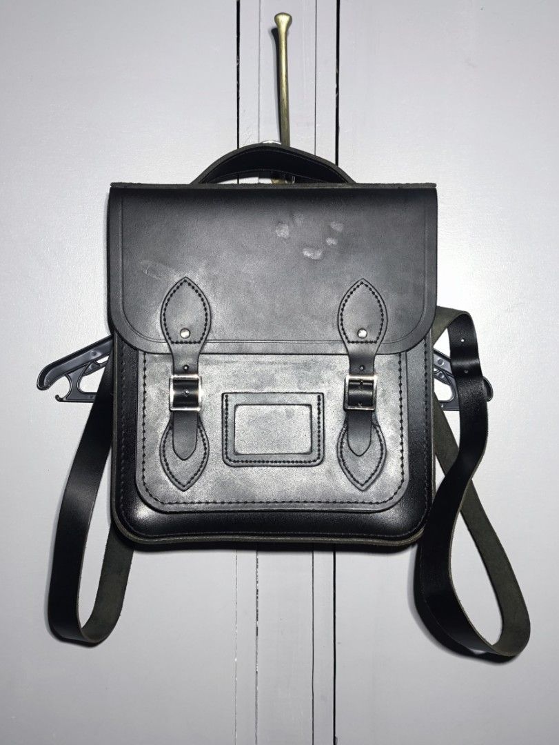 CAMBRIDGE SATCHEL "The Portrait Small Bagpack" (Category: Backpacks) located in Manila. Submitted by rewearables.mnl (Listing ID 1413462354, Image 1). Description: FOR SALE -CAMBRIDGE SATCHEL "The Portrait Small Bagpack" CONDITION:9/10 COLOR RATE:10/10 ISSUE: GLOSS Stain on Flap Part ASKING PRICE:2500 **REWEARABLES PRODUCT DISCLAIMER** All thrift items are pre-loved and may show minor signs of wear or age. Please review photos and descriptions ca
