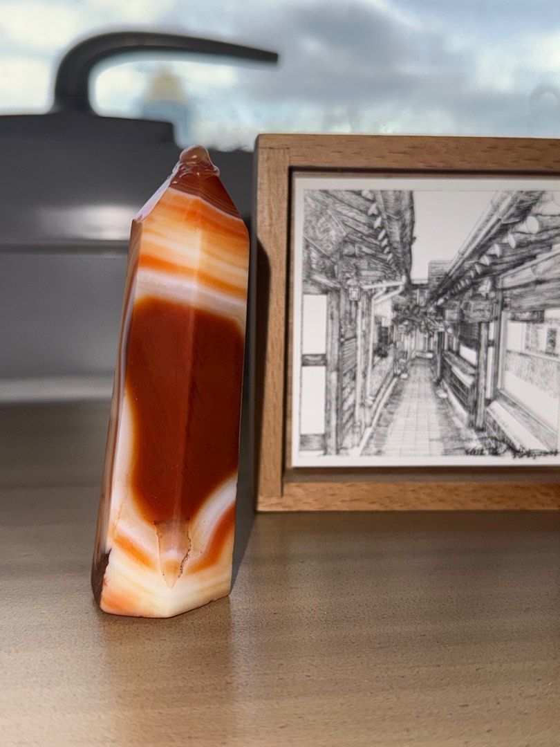 Carnelian Crystal Tower (Category: Everything Else Others) located in Taguig. Submitted by _pattyp (Listing ID 1413513130, Image 2). Description: - Stunning Carnelian crystal tower - Features vibrant orange and white banding - Polished to a smooth finish - Pointed top design - Ideal for crystal enthusiasts .