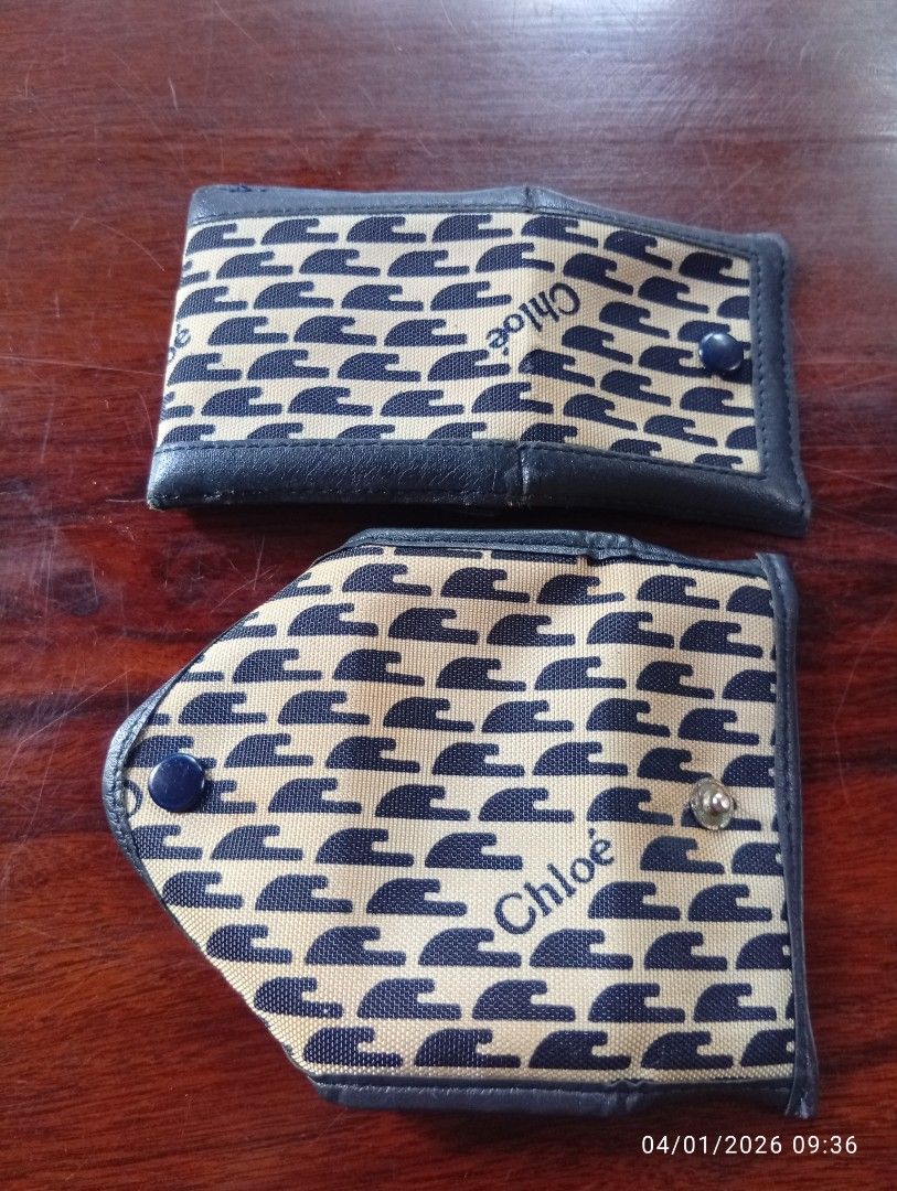 Chloe Key Holder and Coin Purse Set (Category: Luxury Bags & Wallets) located in Cabadbaran. Submitted by lagiuminomtubig1 (Listing ID 1413443720, Image 2). Description: 1980's chloe coinpurse & key wallet - Chloe key holder and coin purse set. - Key holder: snap closure, key ring, approx. 4 inches long. - Coin purse: snap closure, approx. 3 inches wide. - Both: repeating pattern, dark blue leather trim. -issue yellowing .