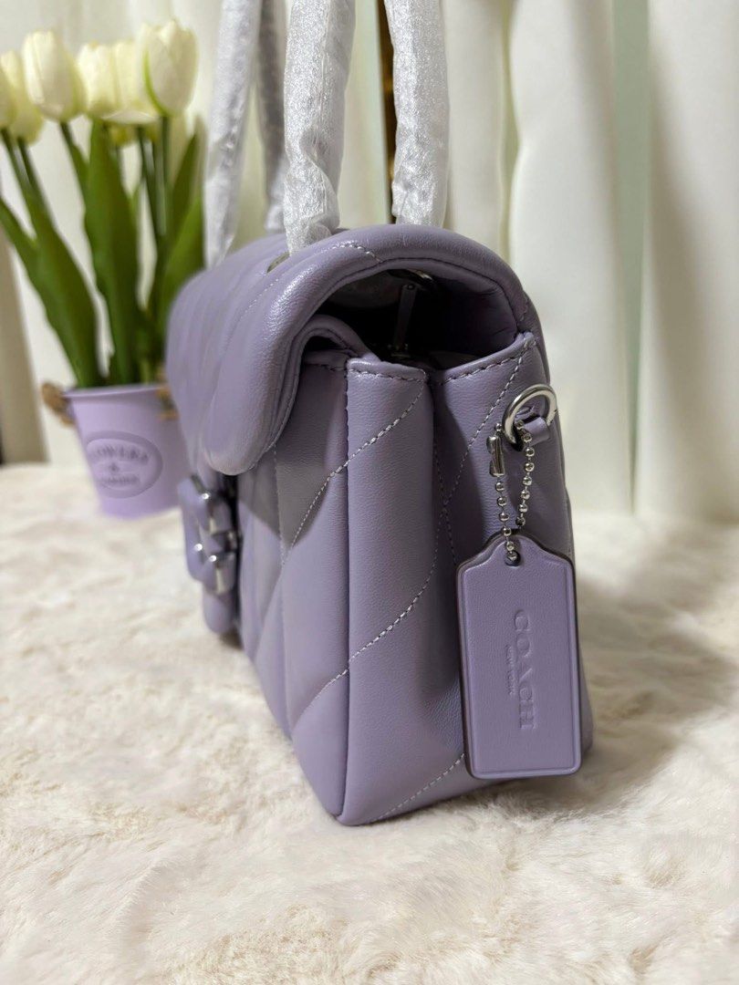 Coach Pillow Tabby Shoulder Bag 26 (Category: Luxury Bags & Wallets) located in San Fernando. Submitted by simplypurseandfragrances (Listing ID 1413477858, Image 3). Description: - Coach Pillow Tabby 26 Shoulder Bag - Stylish lavender color - Quilted design - Signature C clasp - Chain strap - Spacious interior with zip pocket - Includes Coach hang tag.