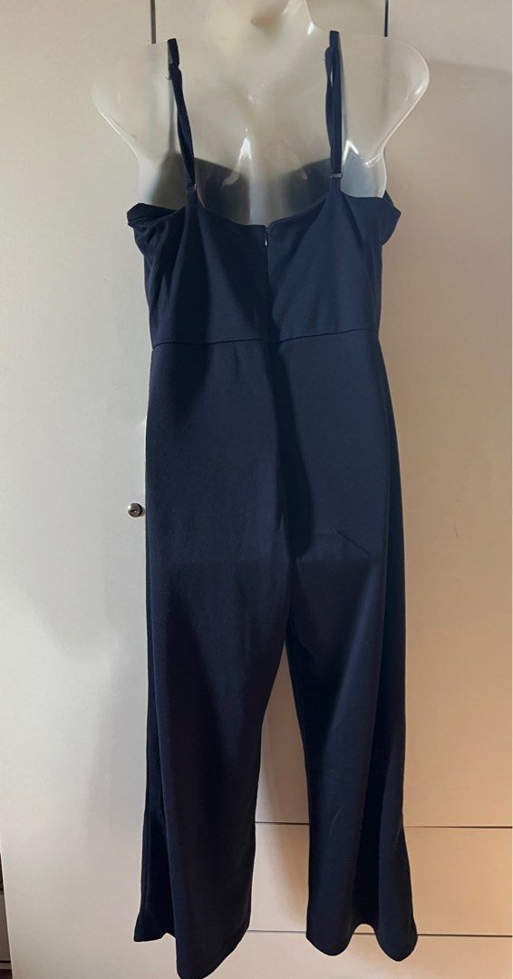 Cotton On Navy Jumpsuit S/P (Category: Jumpsuits) located in Bulacan. Submitted by monaami (Listing ID 1413449474, Image 2). Description: Length from armpit to bottom 100cm Length from top front to bottom 110cm Bust up to 90cm - Cotton On navy jumpsuit - Size: S/P - Features a square neckline - Adjustable straps - Straight leg design - Back zipper closure - Made of smooth, solid fabric.