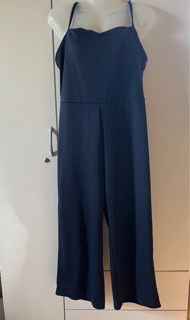Cotton On Navy Jumpsuit S/P (Category: Jumpsuits) located in Bulacan. Submitted by monaami (Listing ID 1413449474, Image 1). Description: Length from armpit to bottom 100cm Length from top front to bottom 110cm Bust up to 90cm - Cotton On navy jumpsuit - Size: S/P - Features a square neckline - Adjustable straps - Straight leg design - Back zipper closure - Made of smooth, solid fabric.
