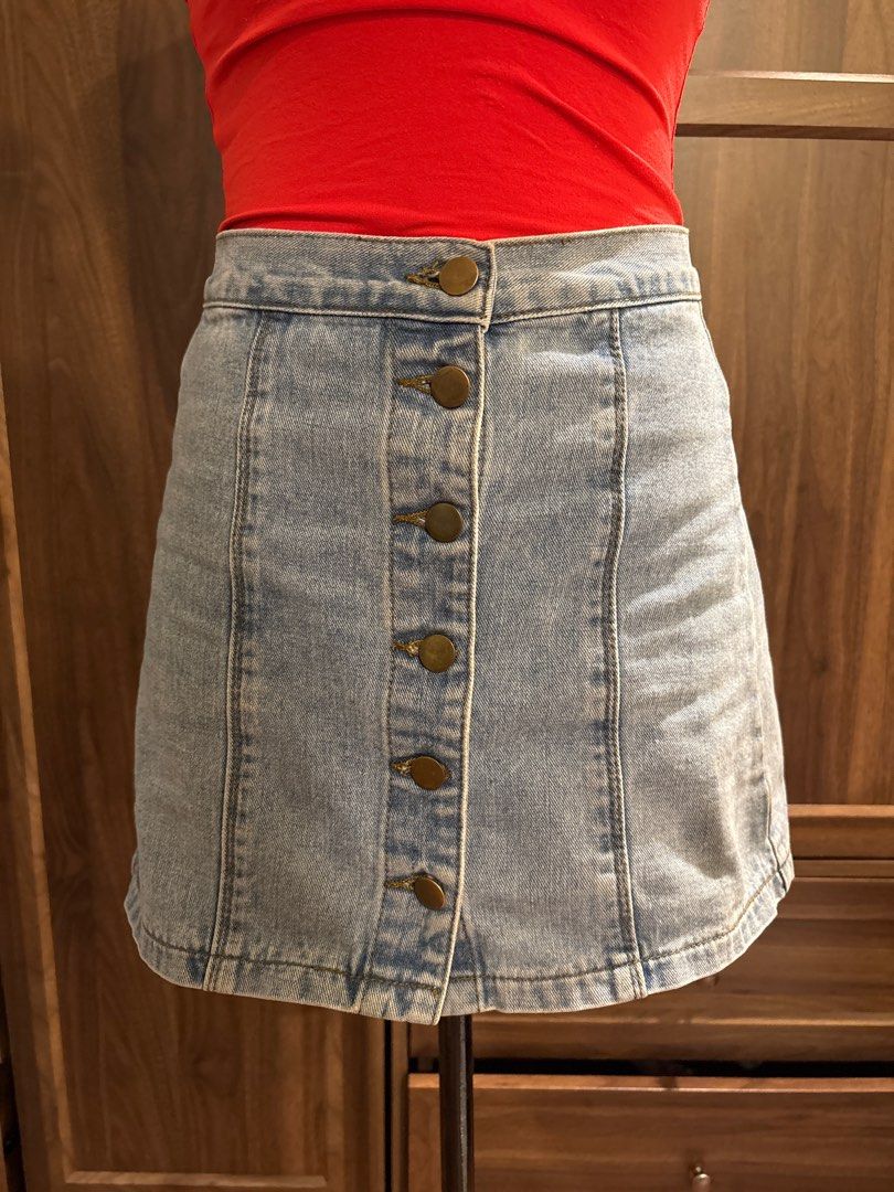 Denim Mini Skirt (Category: Skirts) located in Quezon City. Submitted by kikideclutter (Listing ID 1413570966, Image 2). Description: - Classic denim mini skirt - Light wash - Fitted silhouette - Button closure Fits 24-26 waist.