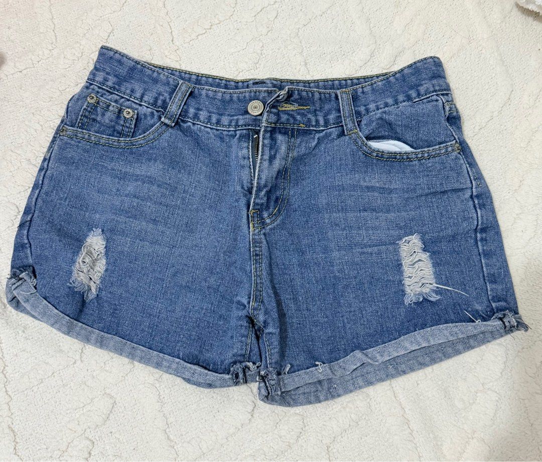 Denim Shorts with Distressed Details (Category: Shorts) located in Pasig City. Submitted by rae-1818 (Listing ID 1413648106, Image 1). Description: 26-27 Size - Blue denim shorts - Distressed detailing - Button and zipper closure - Front and back pockets - Rolled hem - Casual style - Perfect for everyday wear.