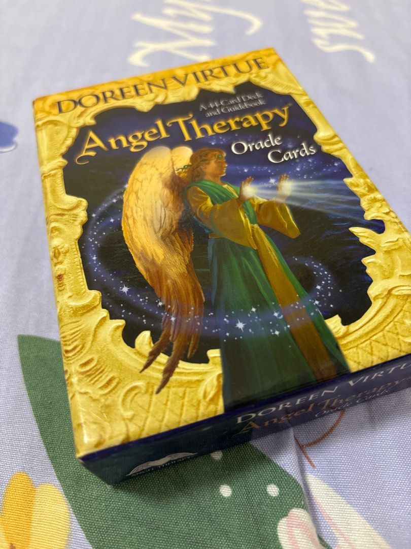 Doreen Virtue Angel Therapy Oracle Cards (Category: Storybooks) located in Quezon City. Submitted by luxgoals (Listing ID 1413516886, Image 1). Description: - Angel Therapy Oracle Cards by Doreen Virtue - Bought in Japan - Includes deck of cards - Box features an angel illustration - Printed in Taiwan - Box has Japanese text and barcode.