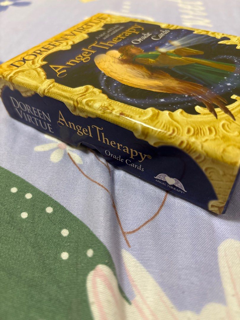 Doreen Virtue Angel Therapy Oracle Cards (Category: Storybooks) located in Quezon City. Submitted by luxgoals (Listing ID 1413516886, Image 2). Description: - Angel Therapy Oracle Cards by Doreen Virtue - Bought in Japan - Includes deck of cards - Box features an angel illustration - Printed in Taiwan - Box has Japanese text and barcode.