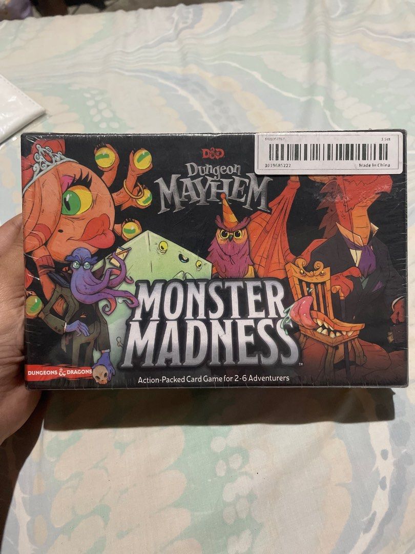DUNGEON MAYHEM : MONSTER MADNESS (CARD GAME) (Category: Board Games & Puzzles) located in Santa Rita. Submitted by apex_curated (Listing ID 1413535764, Image 3). Description: Key Details Publisher: Wizards of the Coast Players: 2 to 6 players Play Time: Approximately 10-15 minutes per game Recommended Age: 8+ Gameplay Mechanics: Players choose one of six unique monster decks, each with distinct powers and playstyles. On your turn, you draw a card