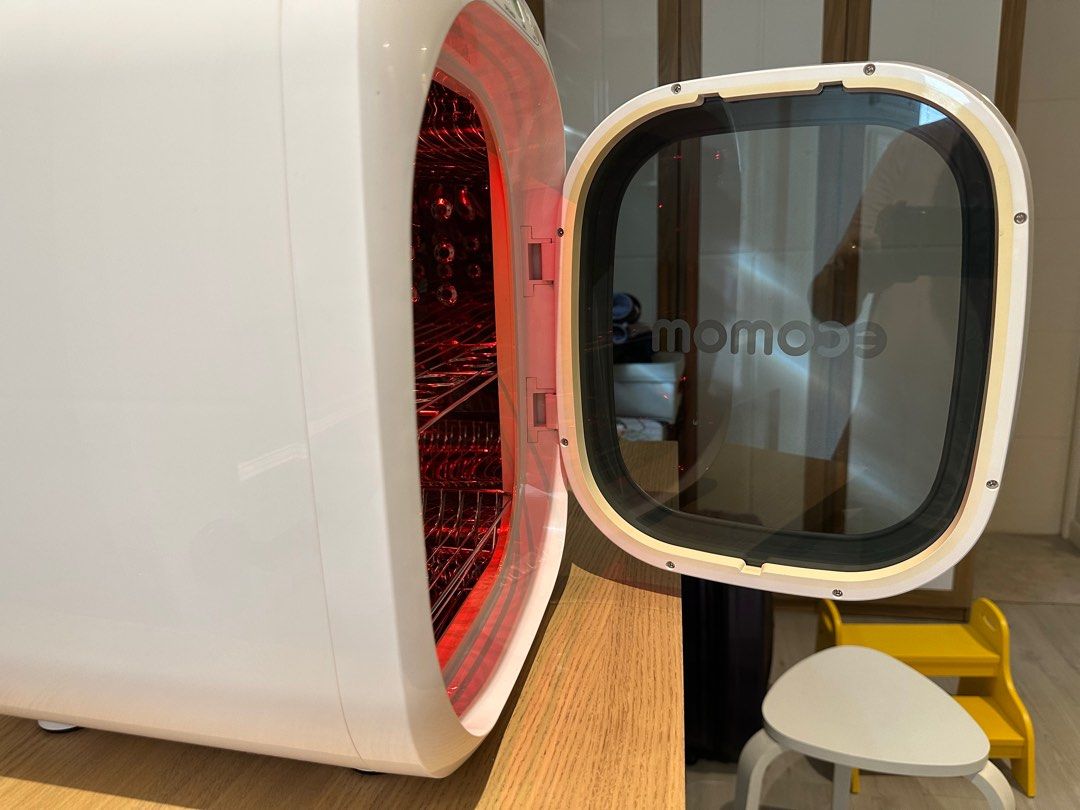 Ecomom UV Sterilizer (Category: Breastfeeding & Bottle Feeding) located in Valenzuela. Submitted by jaylight (Listing ID 1413581102, Image 3). Description: RFS: Decluttering - Ecomom sterilizer with UV, dry/anion, and auto sterilization. - Includes a convenient timer. - Designed for sterilizing various items. - Features multiple racks for organized storage. - Stylish white exterior with a transparent door. - Interior with a red light visible when