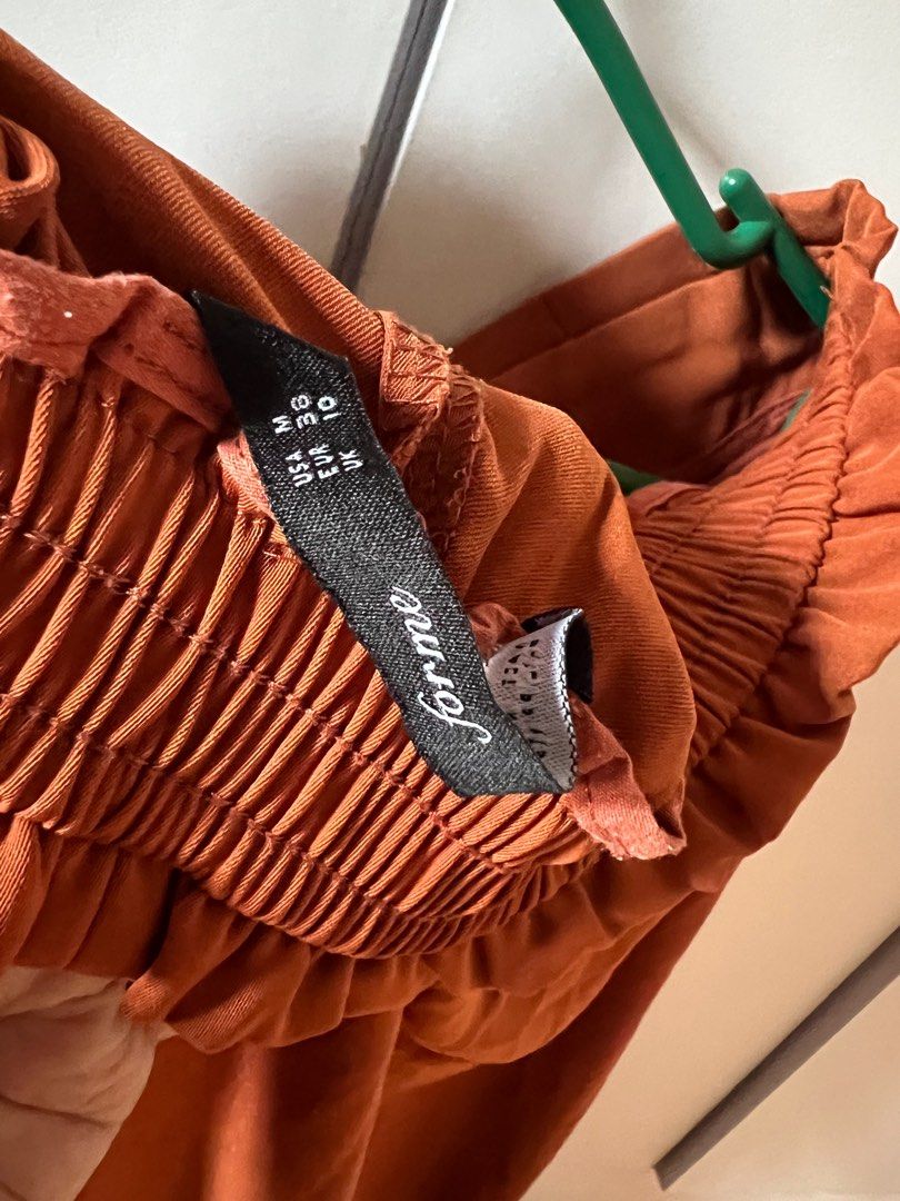 Forme Wide Leg Pants (Category: Other Bottoms) located in Bulacan. Submitted by monaami (Listing ID 1413442504, Image 2). Description: - Foray wide-leg pants - Warm brown color/Orangey - Flattering silhouette with tie waist - Comfortable elastic waistband - Size: UK 10, EUR 36, US 6 - Perfect for a stylish and comfortable outfit.