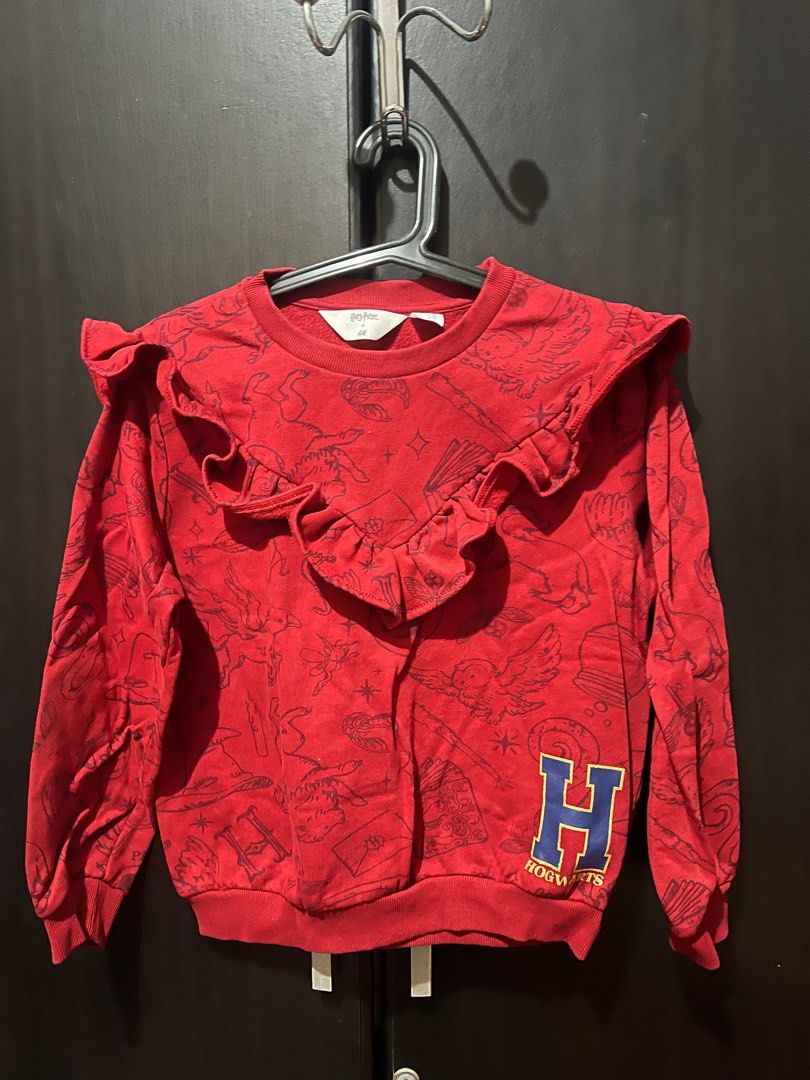 Harry Potter x H&M Sweatshirt (Category: Babies & Kids Fashion) located in San Mateo. Submitted by junked (Listing ID 1413616237, Image 1). Description: - H&M Harry Potter sweatshirt - Size: 8-10 years old - Design: Hogwarts crest and Harry Potter-themed images - Features: Ruffled neckline - Material: Soft, perfect for cooler weather - Ideal for young Harry Potter fans.