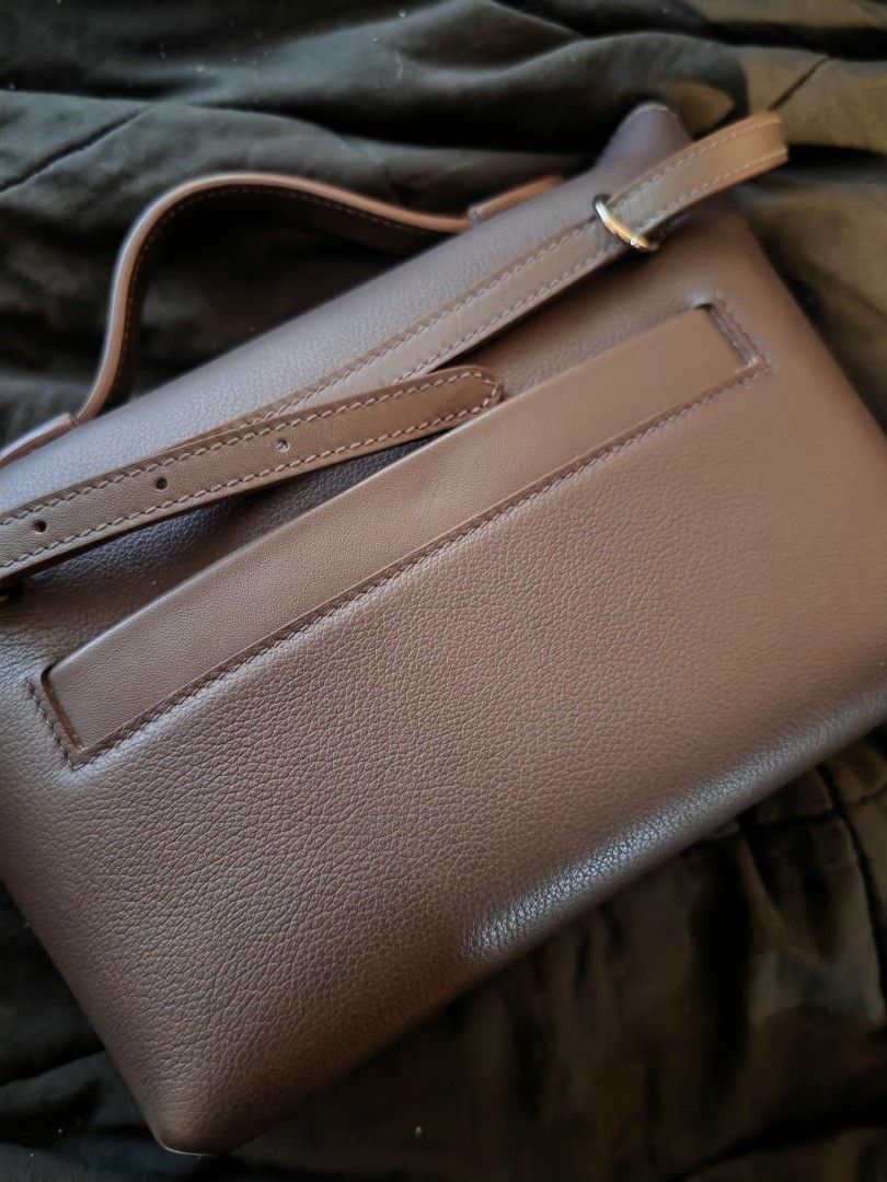Hermes mini 24/24 (Category: Luxury Bags & Wallets) located in Manila. Submitted by shoppingspree008 (Listing ID 1413486301, Image 2). Description: - mini 24/24 with top handle and detachable shoulder strap - Silver-tone clasp with "Hermes Paris" logo - Structured design with flap closure - Textured exterior - Includes a back pocket - with dust bag.