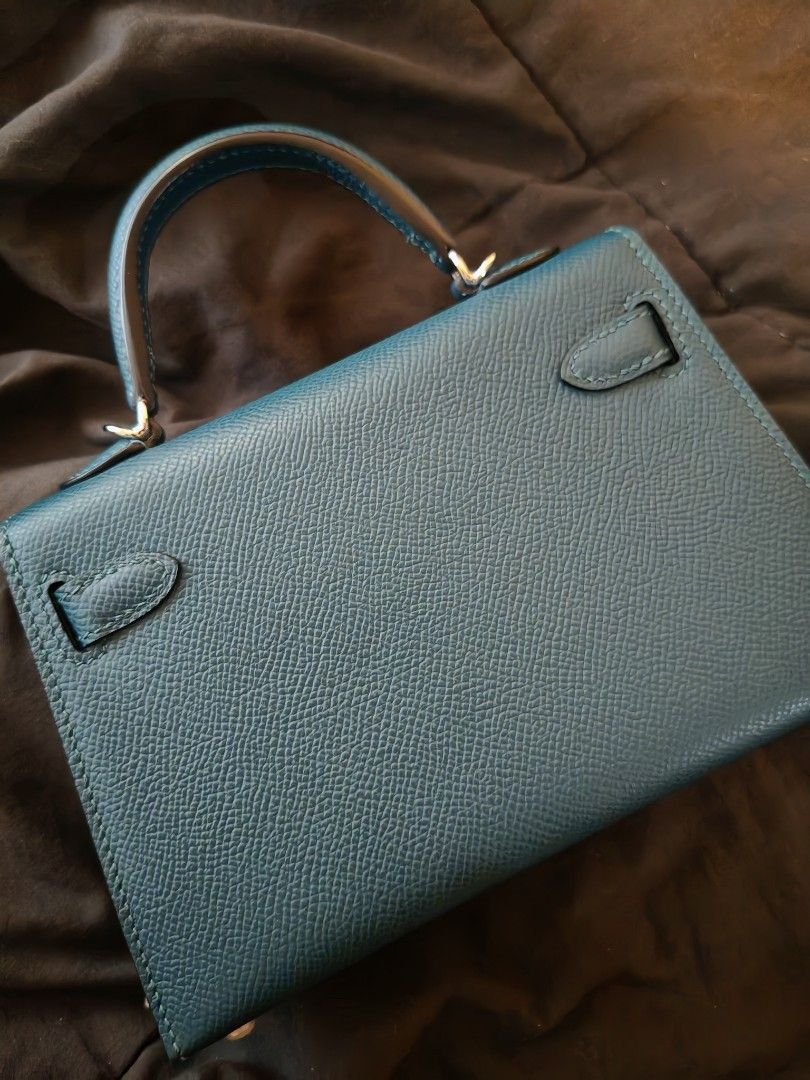 Hermès mini Kelly Handbag (Category: Luxury Bags & Wallets) located in Manila. Submitted by shoppingspree008 (Listing ID 1413485977, Image 3). Description: - Hermès Kelly handbag - Stunning color - Classic top handle design - Secure flap closure with turn lock - Luxurious leather exterior - Matching teal leather interior lining - Elegant silver-tone hardware - Structured shape - Well-maintained condition - with strap and dust bag.