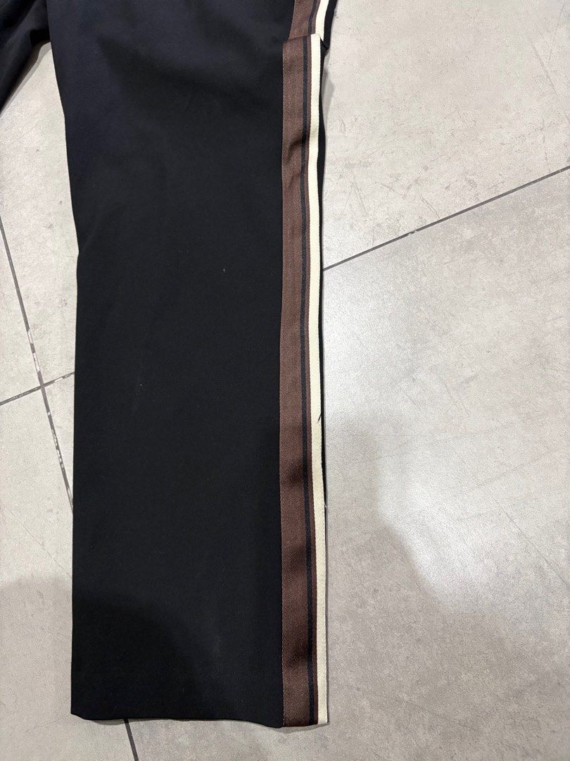 H&M Black Trousers with Side Stripe (Category: Other Bottoms) located in Paranaque City. Submitted by caityprecky (Listing ID 1413493059, Image 3). Description: - H&M black trousers - Side stripe detail - Straight leg cut - Size: EUR 44, UK 16, CN 175/84A - Features front pockets and elastic waistband.