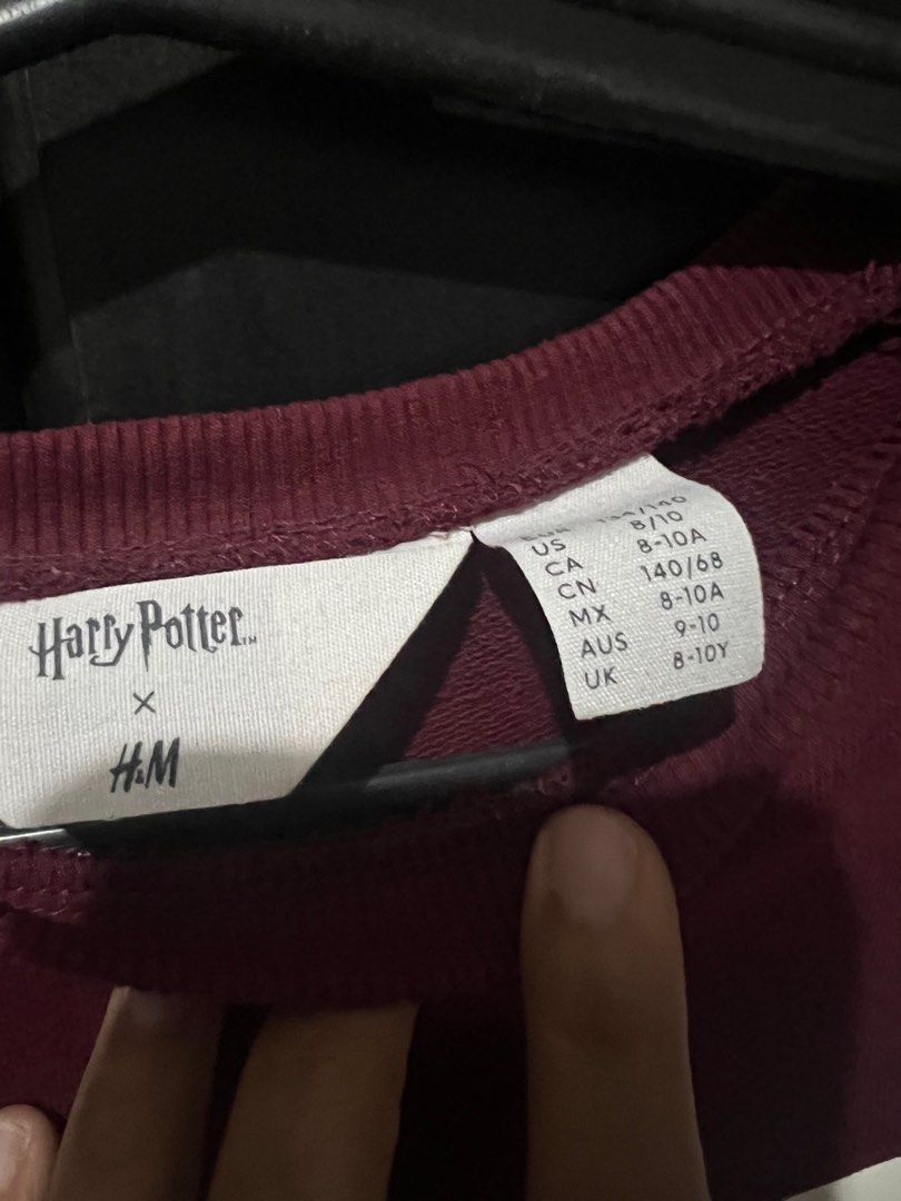 H&M Harry Potter Dress (Category: Babies & Kids Fashion) located in San Mateo. Submitted by junked (Listing ID 1413616780, Image 2). Description: - Harry Potter collaboration dress - Features maroon and pink color block design - Gold stripe detail - Hogwarts crest - Long sleeves - Size: 8-10A - Stylish and comfortable.