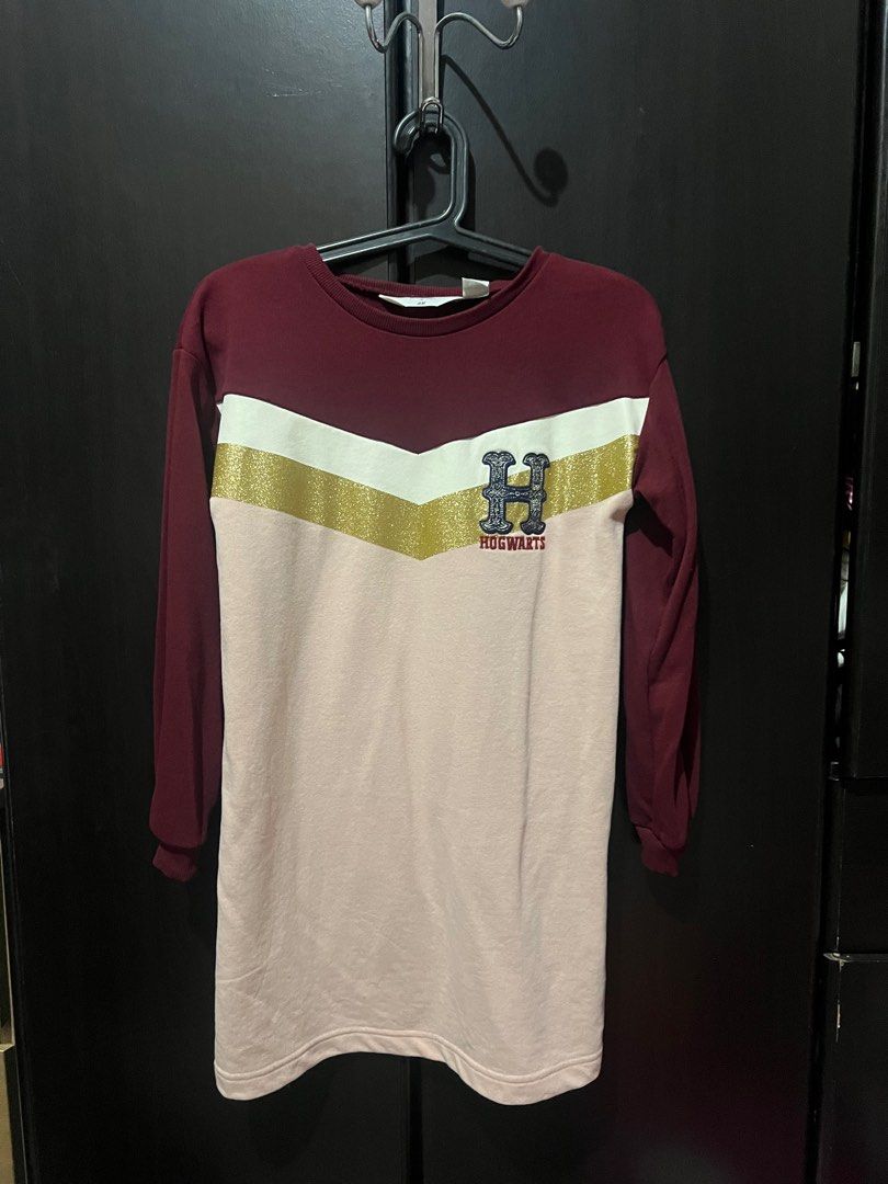 H&M Harry Potter Dress (Category: Babies & Kids Fashion) located in San Mateo. Submitted by junked (Listing ID 1413616780, Image 1). Description: - Harry Potter collaboration dress - Features maroon and pink color block design - Gold stripe detail - Hogwarts crest - Long sleeves - Size: 8-10A - Stylish and comfortable.