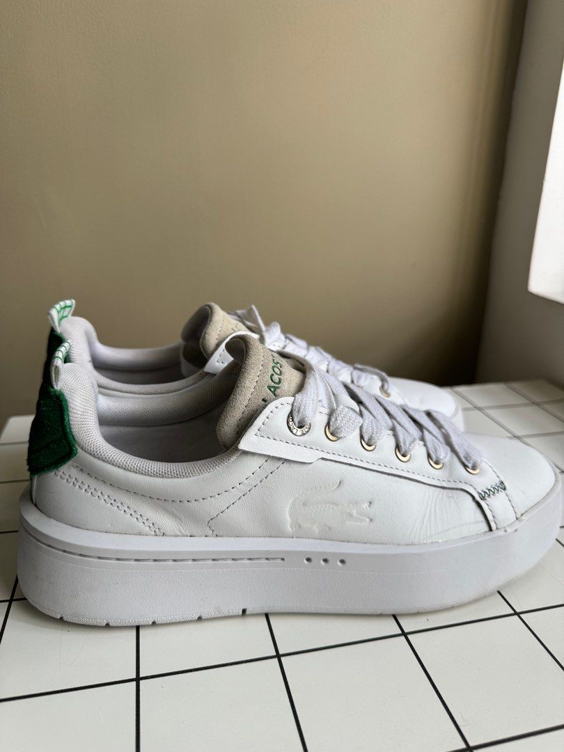 Lacoste Unisex White Sneakers (Category: Sneakers & Footwear) located in Pasig City. Submitted by wilcue (Listing ID 1413445956, Image 2). Description: - Original White Lacoste sneakers - Bought in Taiwan - Very good condition - Green accents - Lacoste logo on side and heel - Ortholite insole - Size: US 8.5, UK 6.5, EUR 40 - White laces and sole - RFS: Decluterring.
