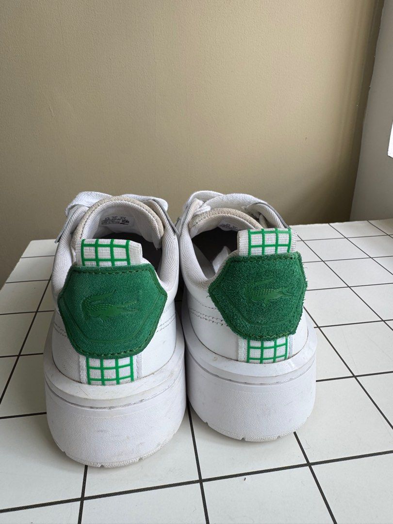 Lacoste Unisex White Sneakers (Category: Sneakers & Footwear) located in Pasig City. Submitted by wilcue (Listing ID 1413445956, Image 3). Description: - Original White Lacoste sneakers - Bought in Taiwan - Very good condition - Green accents - Lacoste logo on side and heel - Ortholite insole - Size: US 8.5, UK 6.5, EUR 40 - White laces and sole - RFS: Decluterring.
