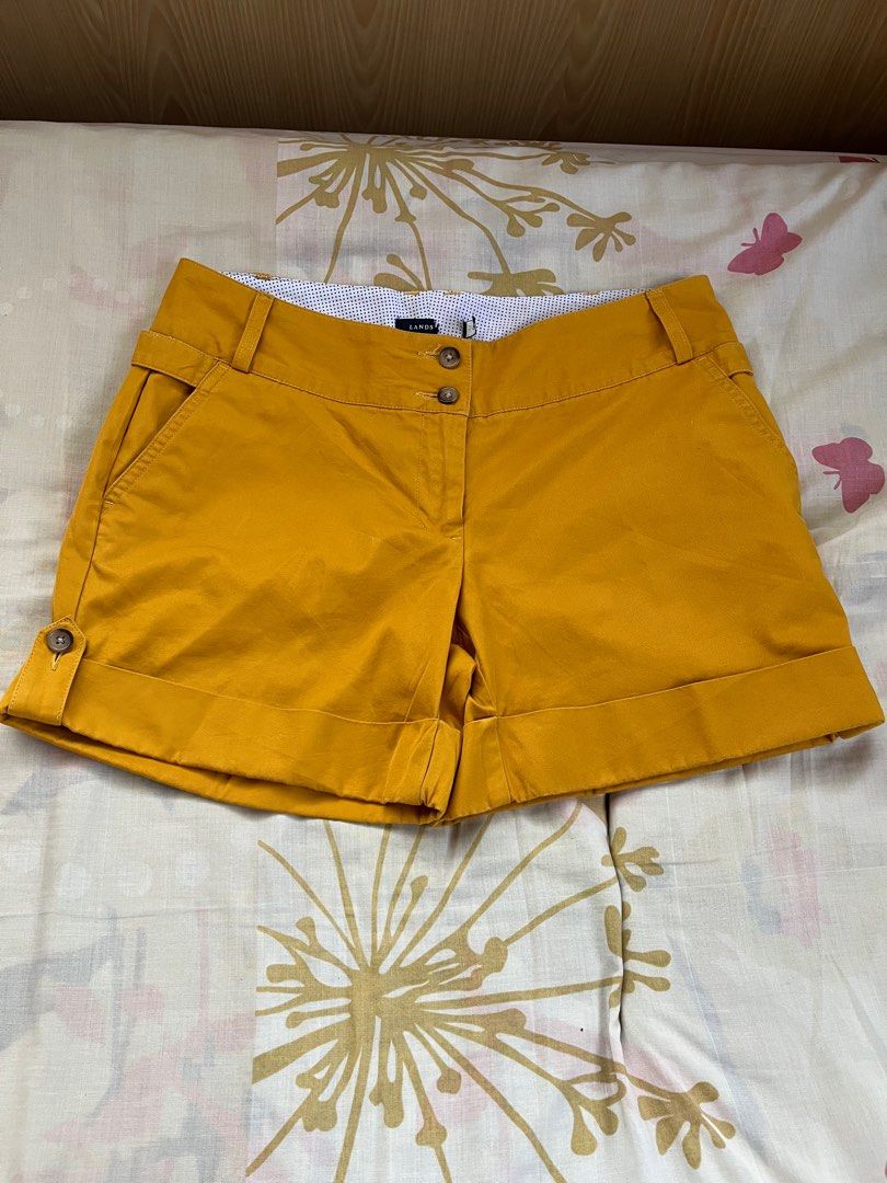 Landsend Mustard Yellow Shorts (Category: Shorts) located in Pasig City. Submitted by gjoconcepcion (Listing ID 1413520844, Image 1). Description: - Landsend mustard yellow shorts - Button and zipper closure - Two front and two back pockets - Folded hem detail - Patterned waistband lining - Tailored fit - Classic design - Ideal for casual wear.