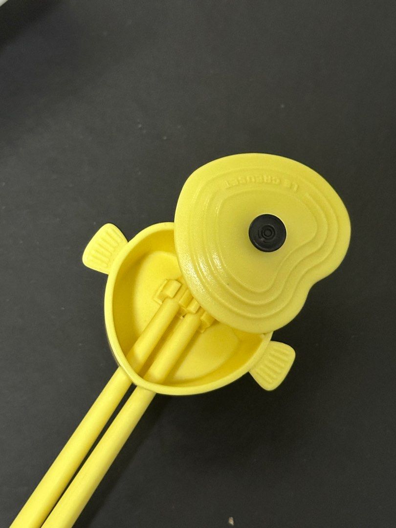 Le Creuset Heart Chopsticks (Category: Dinnerware & Cutlery) located in Makati City. Submitted by vxn.ph (Listing ID 1413595580, Image 3). Description: - Le Creuset chopsticks with a cute heart design. - Comes with a matching case for storage. - Bright yellow color. - Case has a secure closure. - Features the Le Creuset logo..