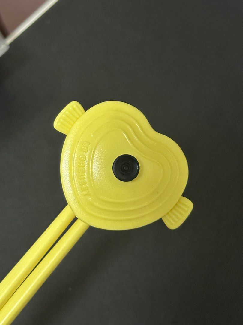 Le Creuset Heart Chopsticks (Category: Dinnerware & Cutlery) located in Makati City. Submitted by vxn.ph (Listing ID 1413595580, Image 2). Description: - Le Creuset chopsticks with a cute heart design. - Comes with a matching case for storage. - Bright yellow color. - Case has a secure closure. - Features the Le Creuset logo..