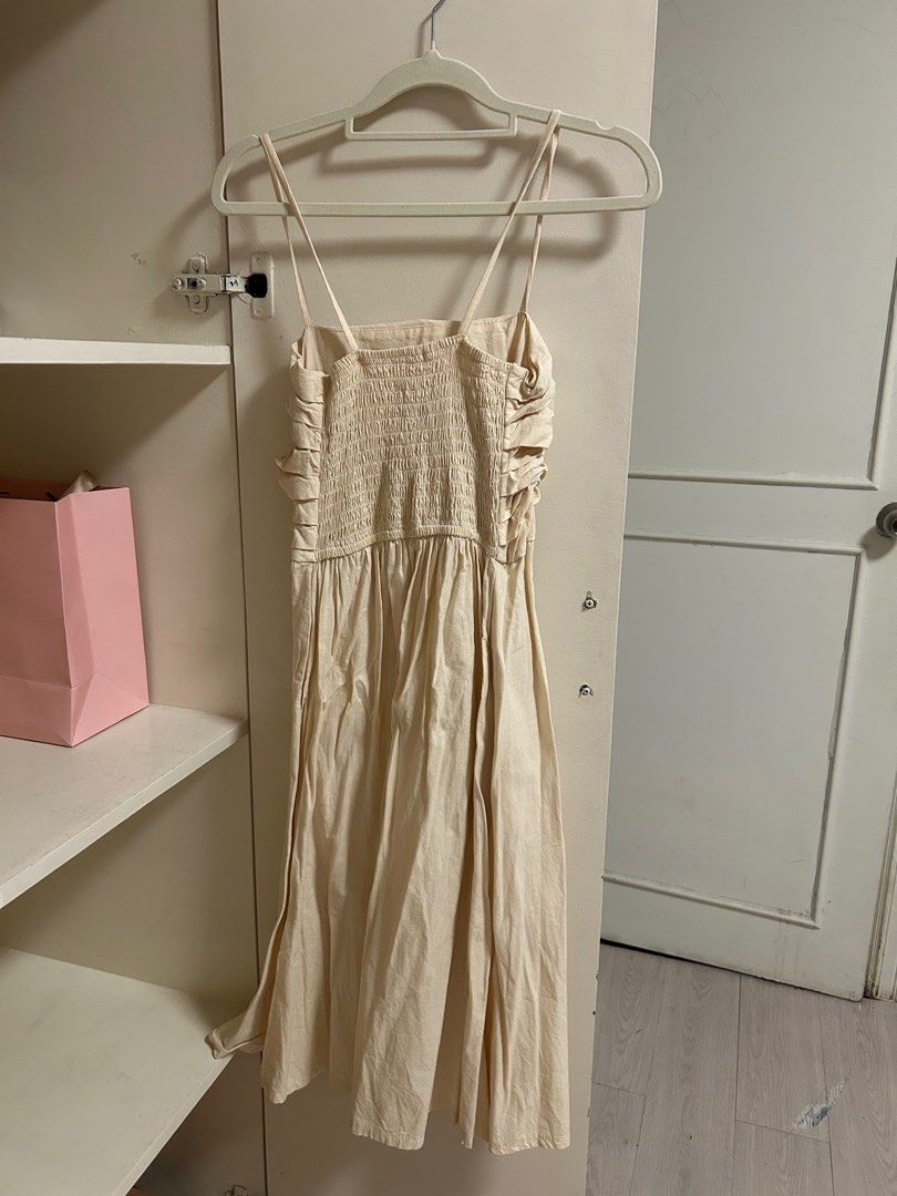 Linen Cream colored Midi Dress (Category: Dresses) located in San Juan City. Submitted by eloise___preloved (Listing ID 1413448258, Image 2). Description: - Cream midi dress - Ruched bodice - Spaghetti straps - Smocked back panel - Flowy skirt - Suitable for casual and special occasions 💳 MOP: GCASH 📦 MOD: j&t or ggx; SDD available via grab or lalamove.