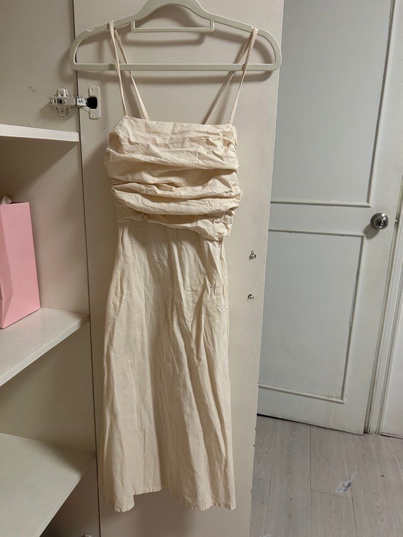 Linen Cream colored Midi Dress (Category: Dresses) located in San Juan City. Submitted by eloise___preloved (Listing ID 1413448258, Image 1). Description: - Cream midi dress - Ruched bodice - Spaghetti straps - Smocked back panel - Flowy skirt - Suitable for casual and special occasions 💳 MOP: GCASH 📦 MOD: j&t or ggx; SDD available via grab or lalamove.