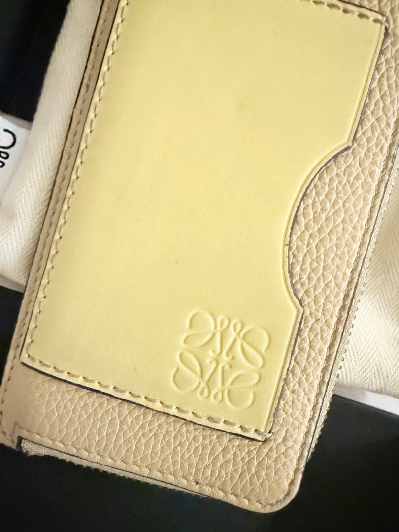 Loewe Anagram Leather Cardholder (Category: Luxury Bags & Wallets) located in Taguig. Submitted by ivychillz (Listing ID 1413623916, Image 3). Description: - Authentic Loewe cardholder - Features cardslots - Includes a zip compartment - Comes with original box and dust bag - Made in Spain - Embossed Loewe logo - Calfskin Leather.
