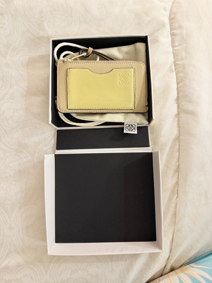 Loewe Anagram Leather Cardholder (Category: Luxury Bags & Wallets) located in Taguig. Submitted by ivychillz (Listing ID 1413623916, Image 1). Description: - Authentic Loewe cardholder - Features cardslots - Includes a zip compartment - Comes with original box and dust bag - Made in Spain - Embossed Loewe logo - Calfskin Leather.